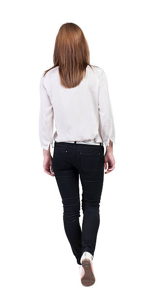istock back view of walking  woman in jeans. 515629865