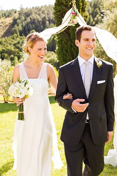 istock Bride And Groom Walking While Looking Away At Wedding 515630435