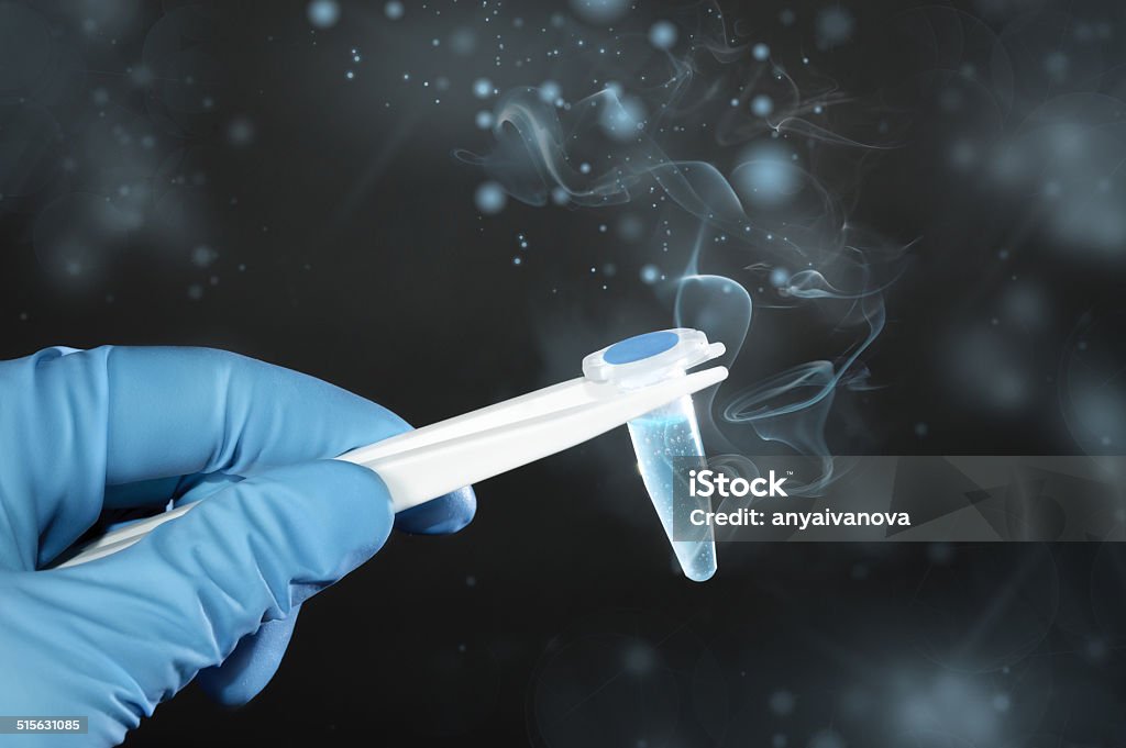 Ice-cold scientific or medical sample on dark background Thawing cryosample taken out of cryostorage on dark green background, text space Sperm Stock Photo