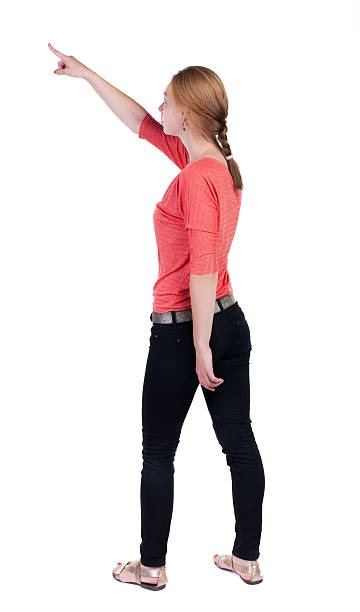 istock Back view of  pointing woman. 515632611