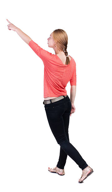 istock back view of walking  woman in jeans. 515632621