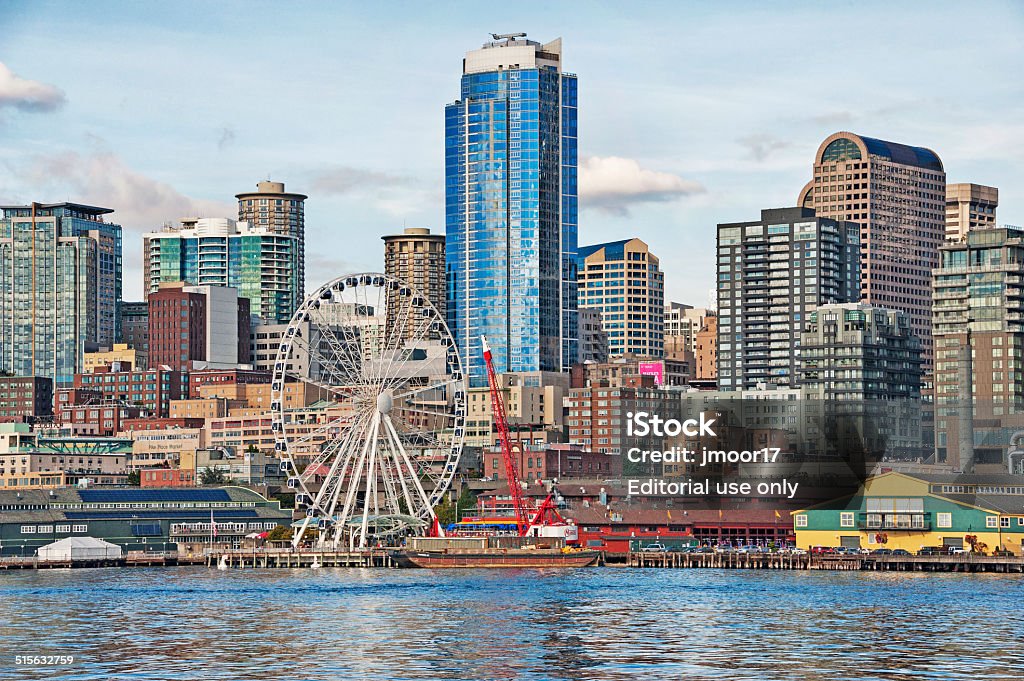 Seattle Waterfront View from Ferry Seattle, Washingon, USA - September 19, 2014: This view from the water shows the various highrises many other structures as well as the very large Ferris Wheel as well as other commercial buildings along the waterfront in Downtown Seattle on this September day. Building Exterior Stock Photo