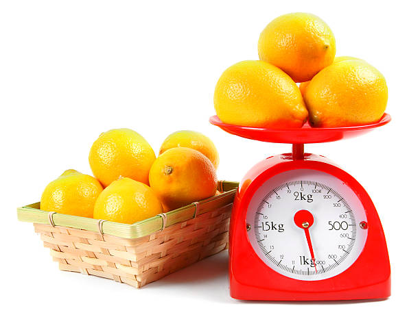 istock Lemons on scales and in a basket. 515633507