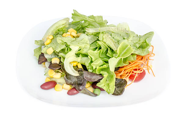 istock fresh vegetable salad  in a white plate isolated on white background 515633691