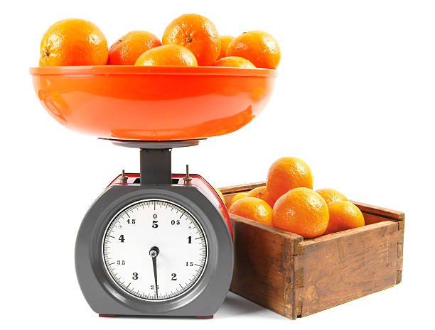 istock Tangerines on scales and in a box 515633859