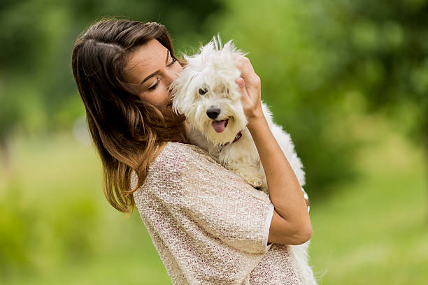 istock Young woman with a dog 515633941