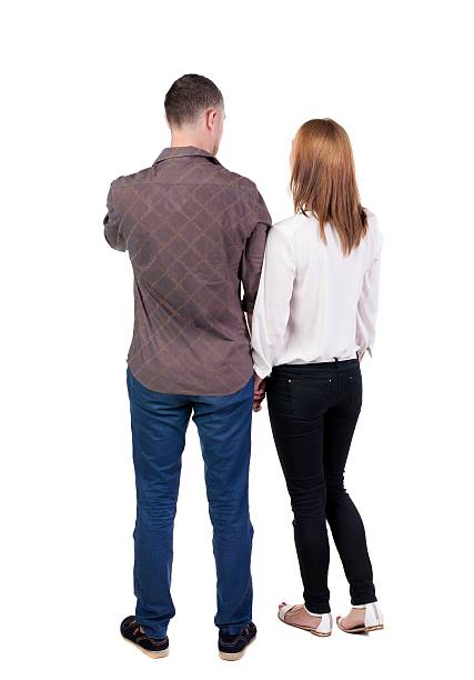 istock Back view of young embracing couple 515633949