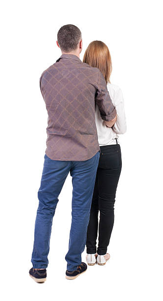 istock Back view of young embracing couple 515633957