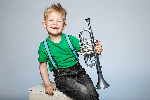 istock Happy child with trumpet 515635077