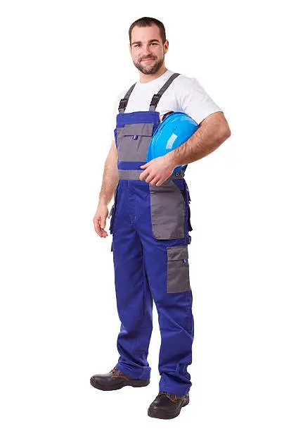 Male construction worker with blue helmet and uniform