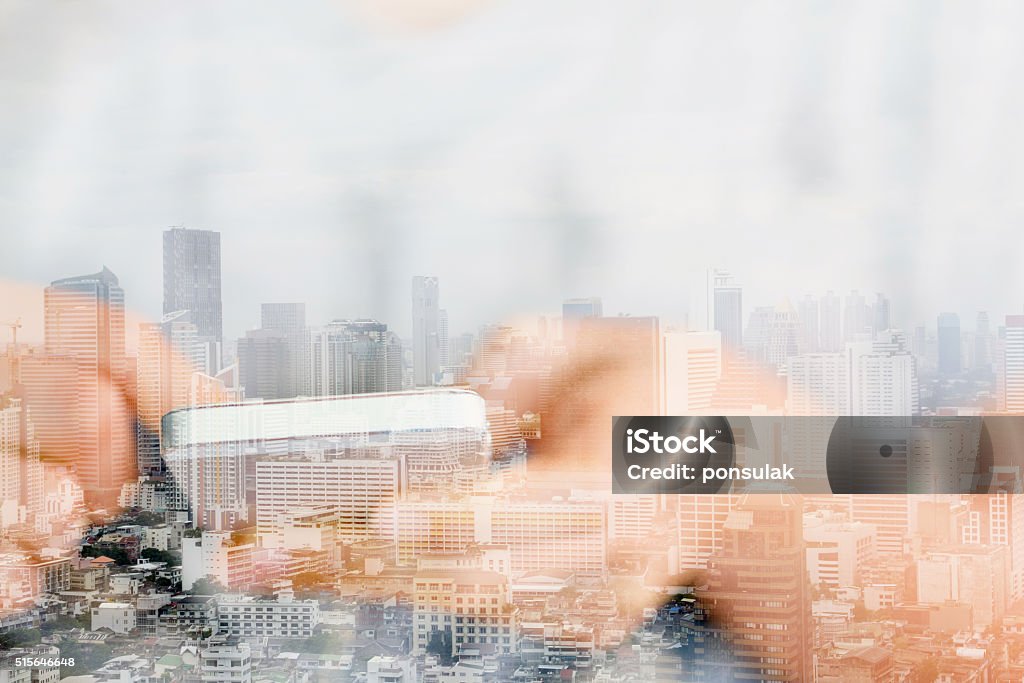 communication technology concept. Double exposure image of people with smart phone and cityscape background,communication technology concept.  Multiple Exposure Stock Photo