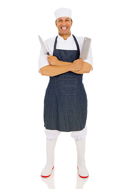 istock middle aged male butcher holding knives 515648250
