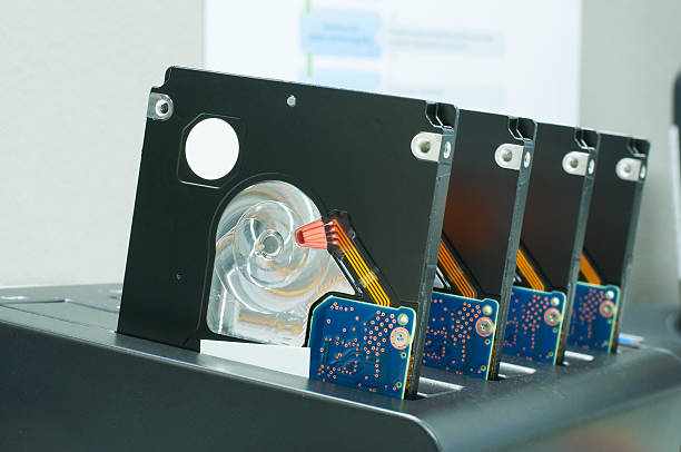 istock Row of clone harddisk drives in cloning dock 515649252