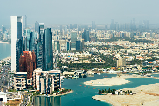 Part of Abu Dhabi, UAE with surrounding area viewed from the helicopter. Many details are visible in the image.