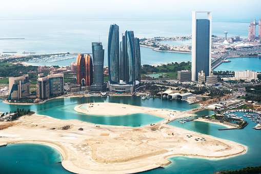 Part of Abu Dhabi, UAE with surrounding area viewed from the helicopter. Many details are visible in the image.