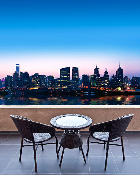 istock Table and chairs on a terrace, view on a city 515653718