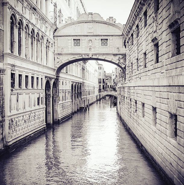 Venice, Italy - October 23, 2016: In this picture, in particular: the famous Bridge of Sighs, in black and white, with gondolas.