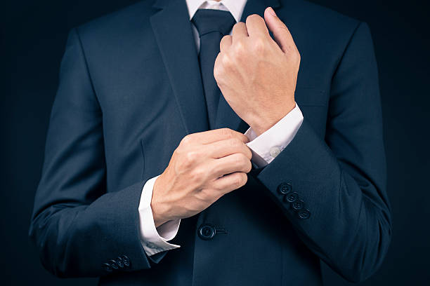 istock Businessman Fixing Cufflinks his Suit 515655606