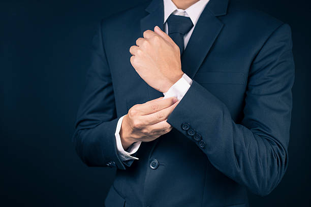 istock Businessman Fixing Cufflinks his Suit 515655718