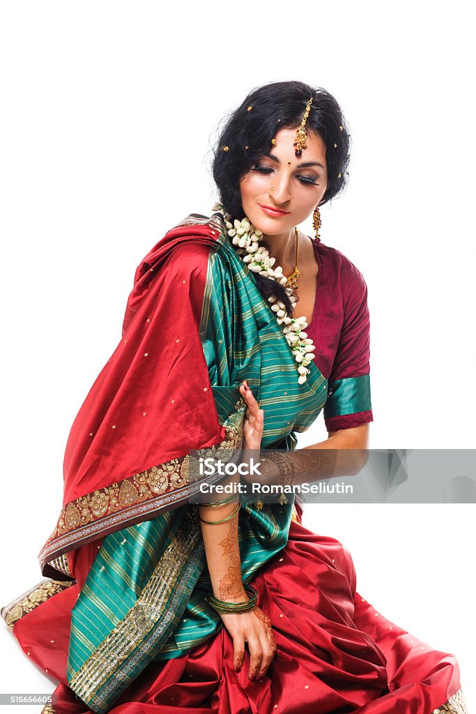 Beautiful young indian woman in traditional clothing, isolated on white Beautiful young indian woman in traditional clothing, isolated on white background Bollywood Stock Photo