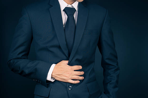 istock Businessman Has Stomach Ache 515656902
