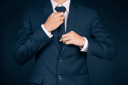 Businessman Adjusting His Necktie