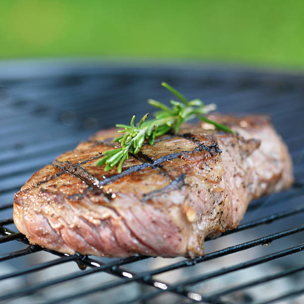 istock steak on grill with rosemary 515658373