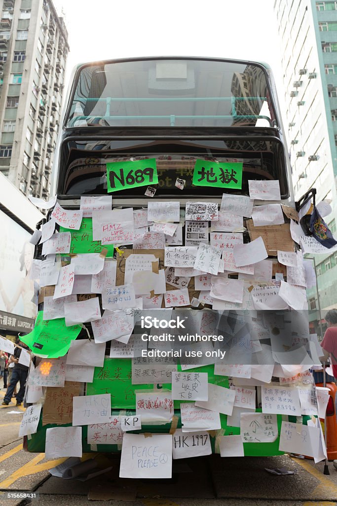 Hong Kong Occupy Central Protests Hong Kong, Hong Kong SAR - September 30, 2014: Placards on a empty bus in Hong Kong. Occupy Central is a civil disobedience movement which began in Hong Kong on September 28, 2014. Bus Stock Photo