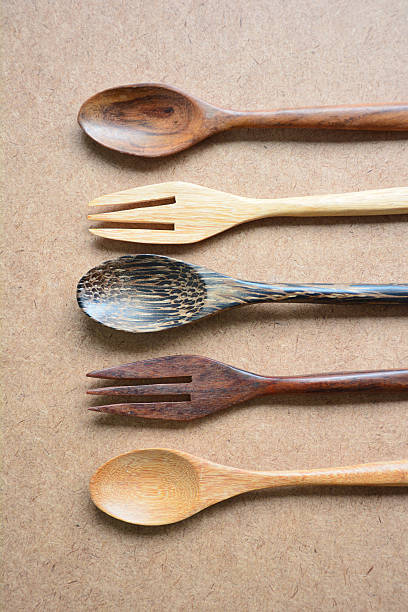 istock Wooden spoons and forks on wooden table. 515659211