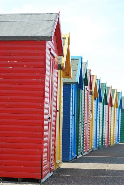 istock Brightly colored wooden beach huts 515660589