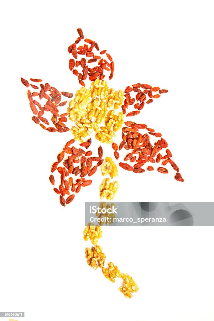 Creative Goji and nuts flower Composition of goji and nuts Antioxidant Stock Photo