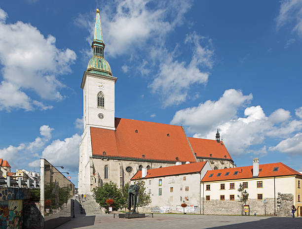 Bratislva, Slovakia - September 21, 2014: Bratislava - St. Martins cathedral from south and memorial of holocaust and number of peoples on the square.