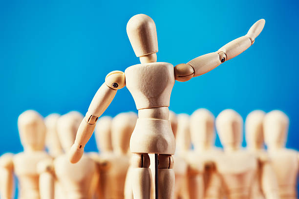 istock Wooden figure addressing puppet audience 515663133