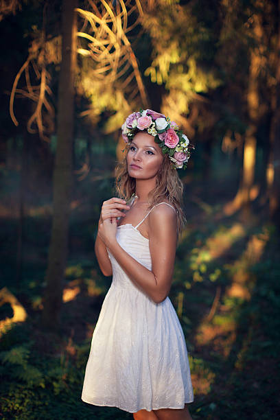 istock beautiful blond young woman in the forest 515664283