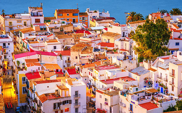 Colorful Ibiza Down Town Elevated view on colorful Ibiza Down Town at dusk. ibiza island stock pictures, royalty-free photos & images