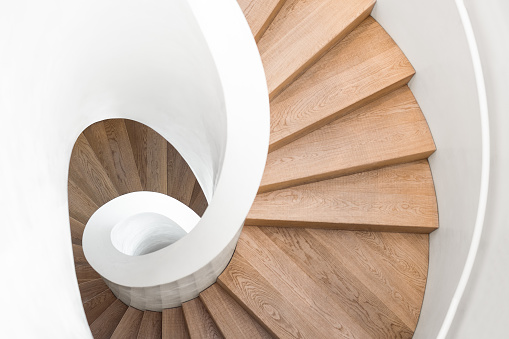 symbol of a modern staircase, spiral staircase inside the building luxury, staircase in villa, wooden spiral staircase, minimalist staircase