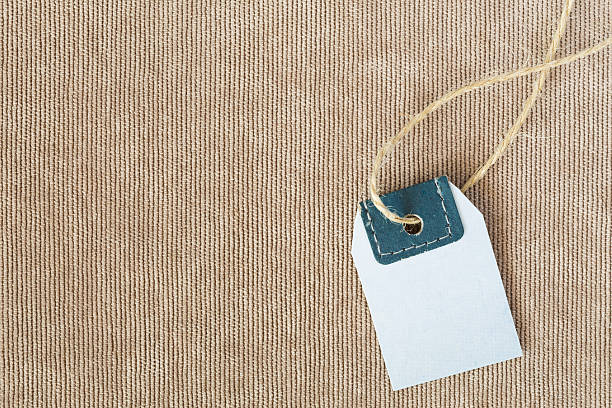 istock Light neutral beige Fabric Background and blank Price Tag 515672888