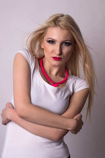 istock Sexy blonde woman over a grey background 515673916