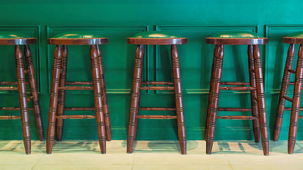 istock Row of green wooden stools 515675084