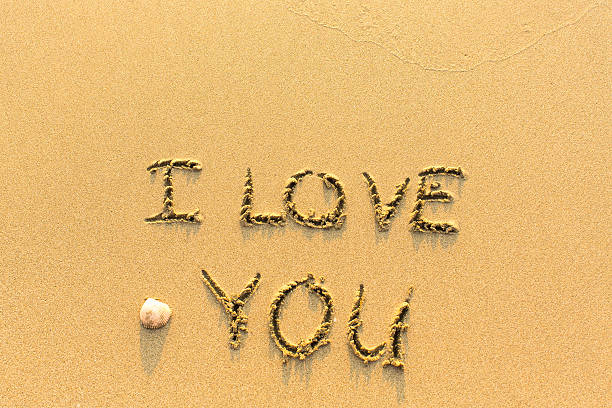 istock I Love You - inscription on sand beach. 515675784
