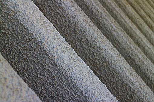 Grey textured concrete girders abstract