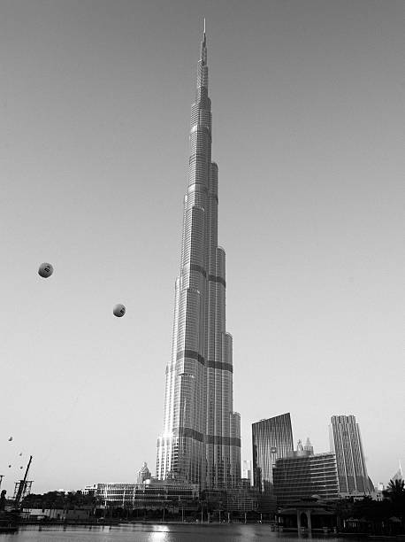 Dubai, UAE - September 16, 2024: Burj Khalifa in Dubai, United Arab Emirates. With a total height of 829.8 m (2,722 ft) and a roof height (excluding antenna, but including a 242.6 m spire) of 828 m (2,717 ft), the Burj Khalifa has been the tallest structure and building in the world since its topping out in 2009.