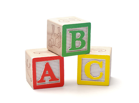 Wooden alphabet blocks isolated on white background