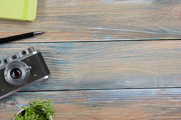 istock Tourism, travel concept. Office desk table with notepad, camera and 515680790
