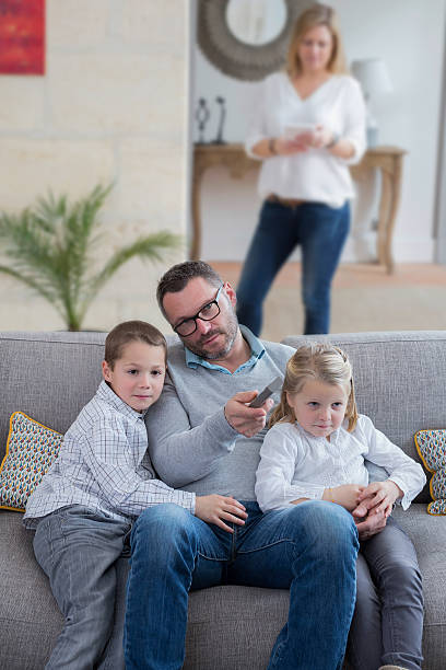 istock family at home relaxing on couch 515681084