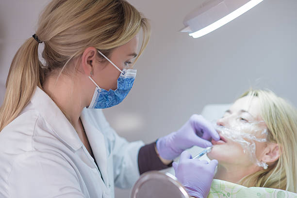 istock Mature woman getting a botox injection 515681408