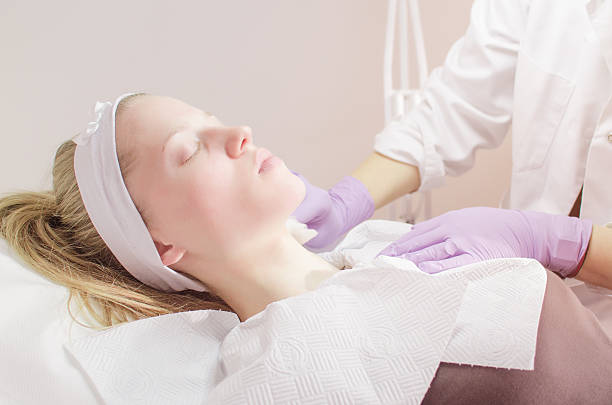 istock Young woman getting a facial treatment 515681774
