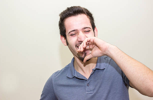 istock Portrait of laughing young man over colored background 515682648