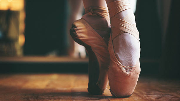 istock Ballet dancer feet close up shot 515683220