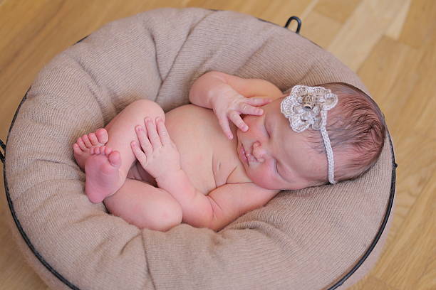 istock Cute newborn baby girl sleeping 515684752